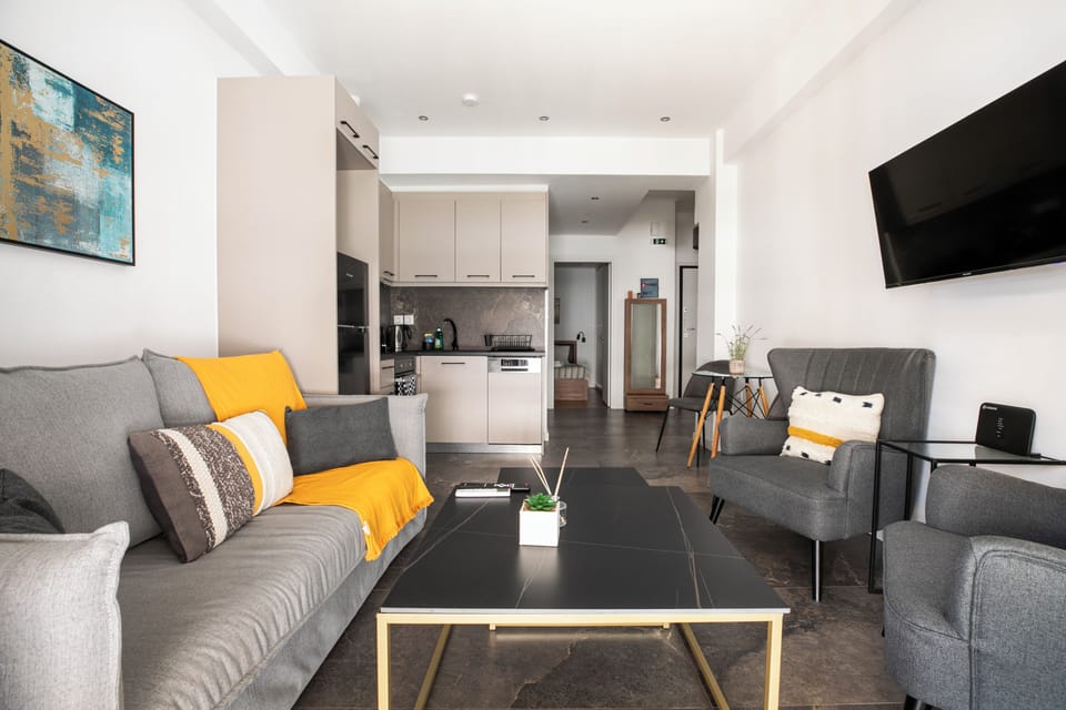 Apartment, 2 Bedrooms, Balcony, City View | Living room | 38-inch Smart TV with cable channels, streaming services