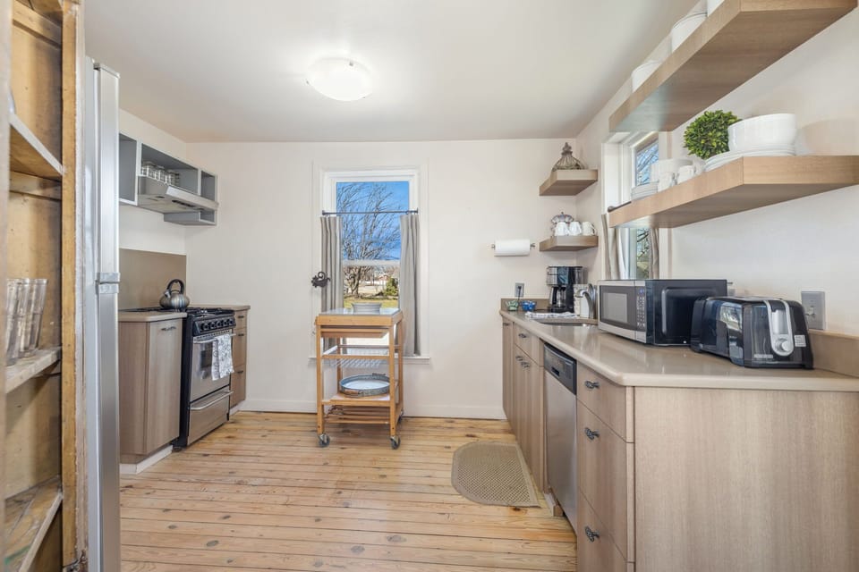 It includes modern appliances, cookware, and utensils, ensuring convenience for any culinary experience.