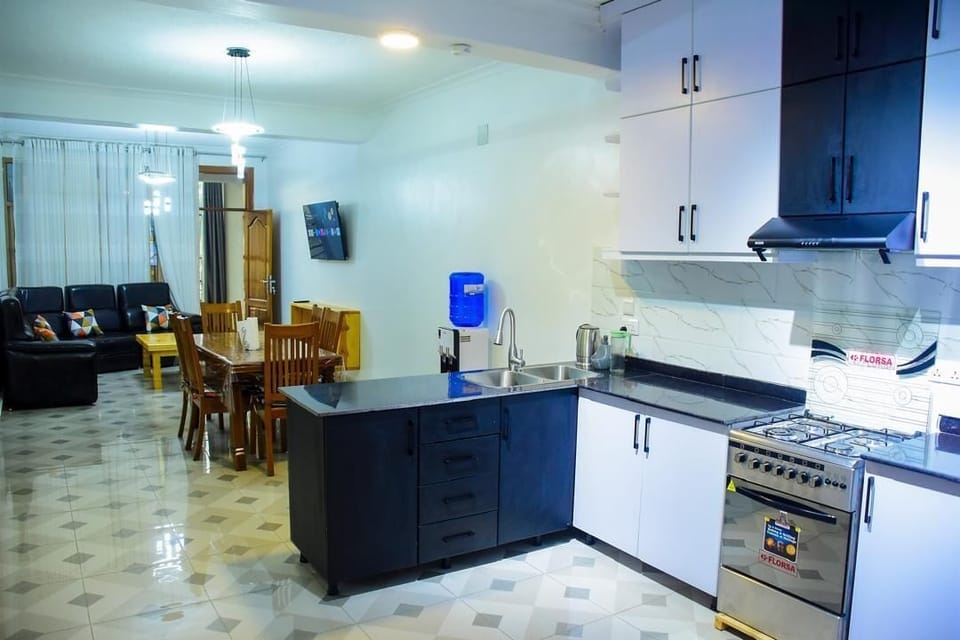 Family Apartment, City View | In-room safe, desk, laptop workspace, iron/ironing board
