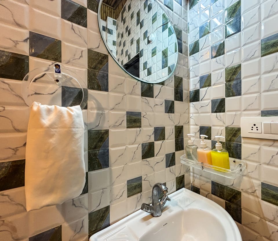 Family Suite | Bathroom | Shower, slippers, towels, soap