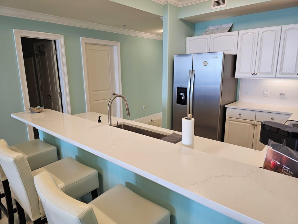 Bar in front of kitchen.