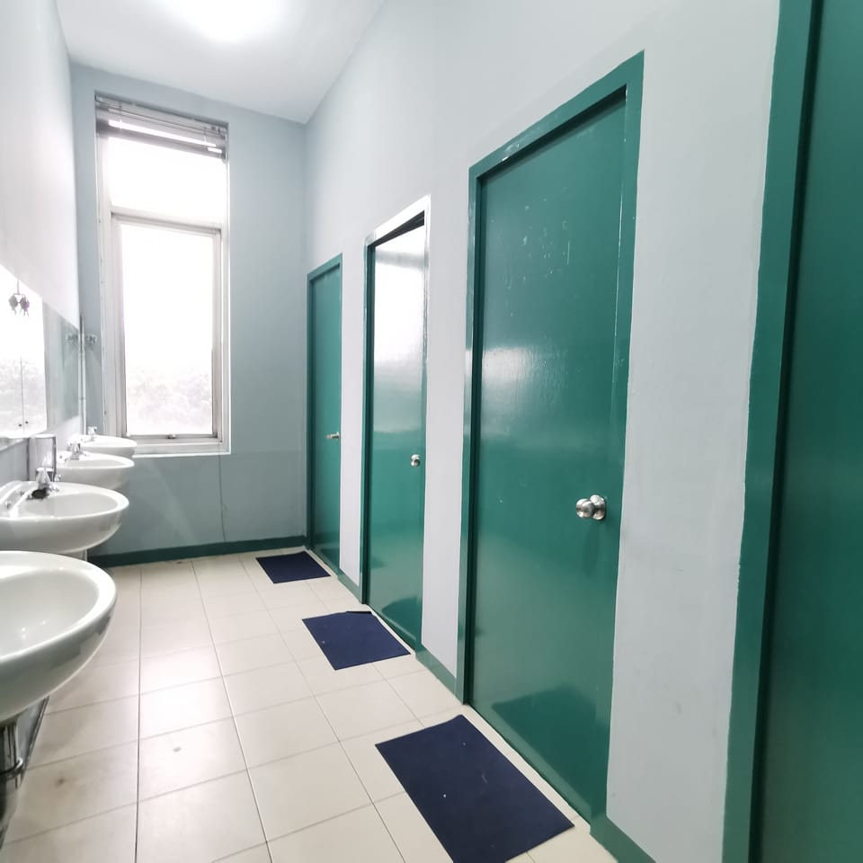 Basic Shared Dormitory - Female | Bathroom | Shower, towels, soap, shampoo