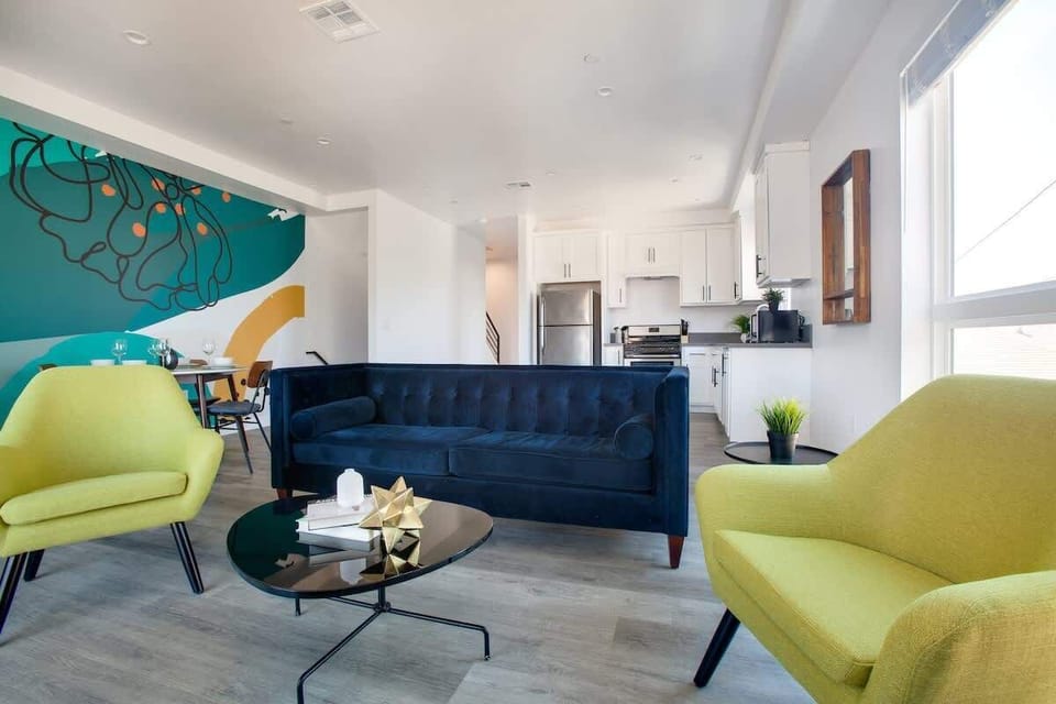 Stylish living room with cozy seating and vibrant accents