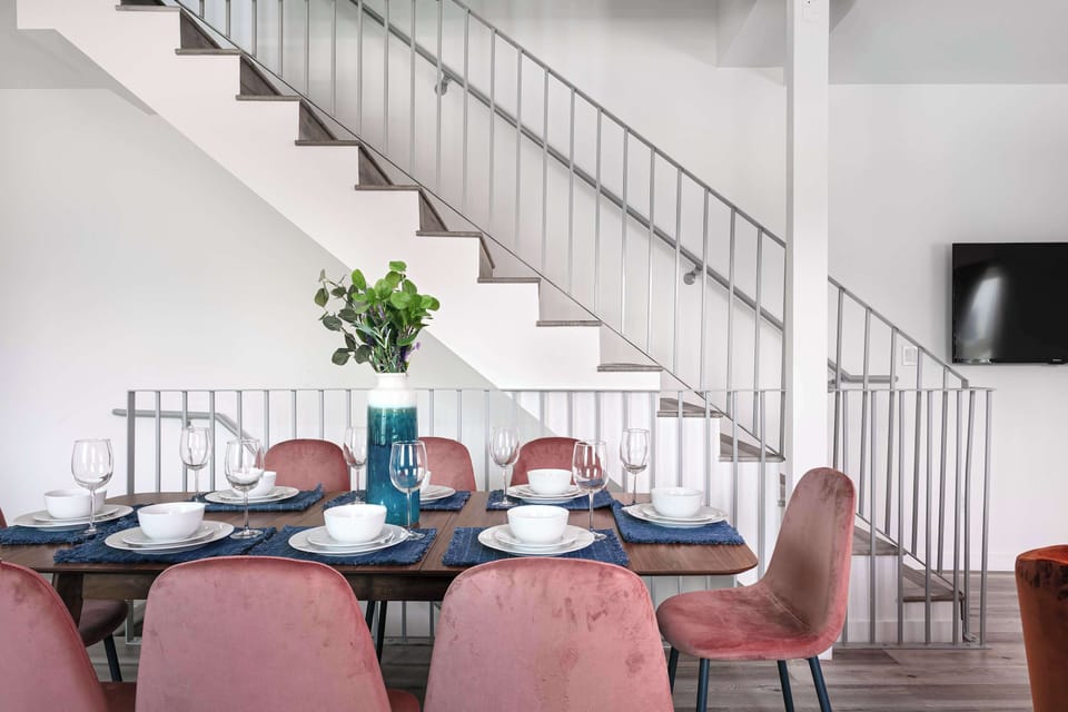 Dining area with staircase view and elegant setup
