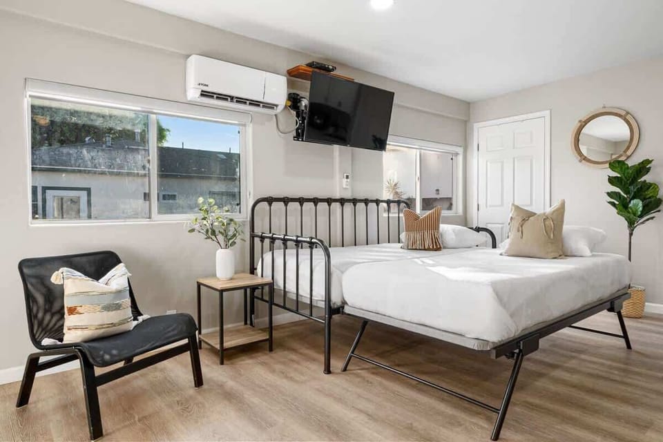 Bright bedroom with open layout and large windows
