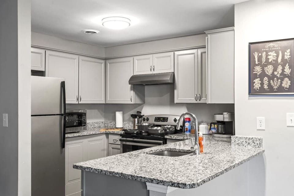 Kitchen: Culinary adventures await in this modern space with stainless steel appliances!