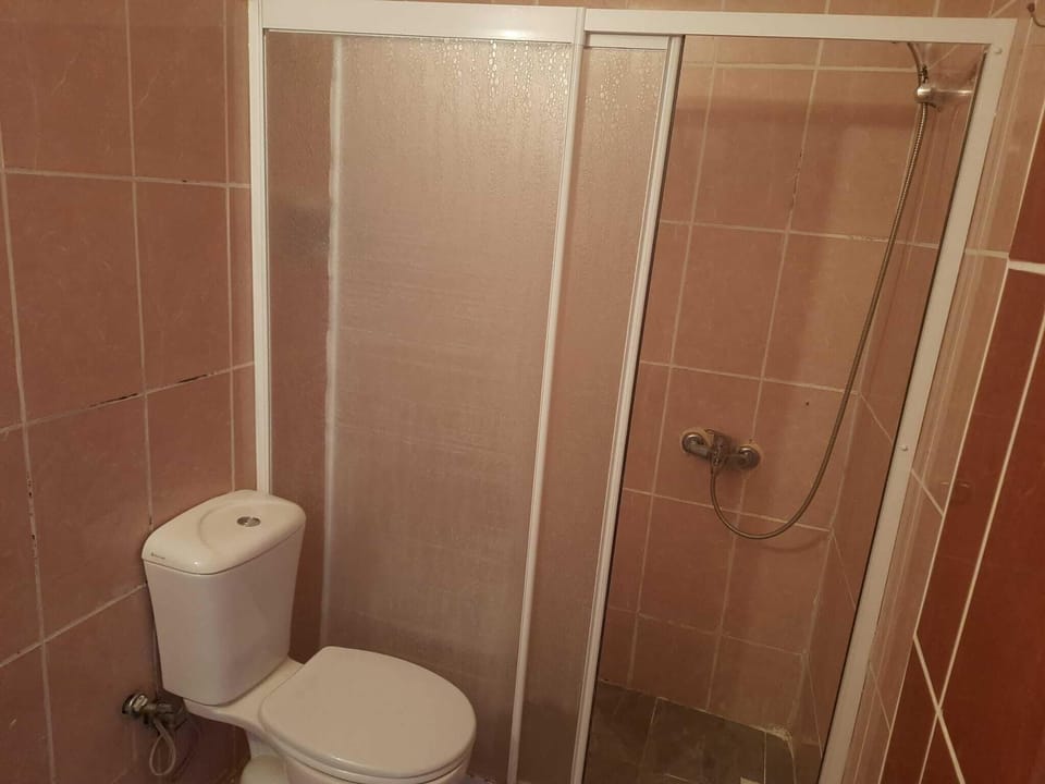 Triple Room, Balcony, City View | Bathroom | Shower, hair dryer, towels, soap