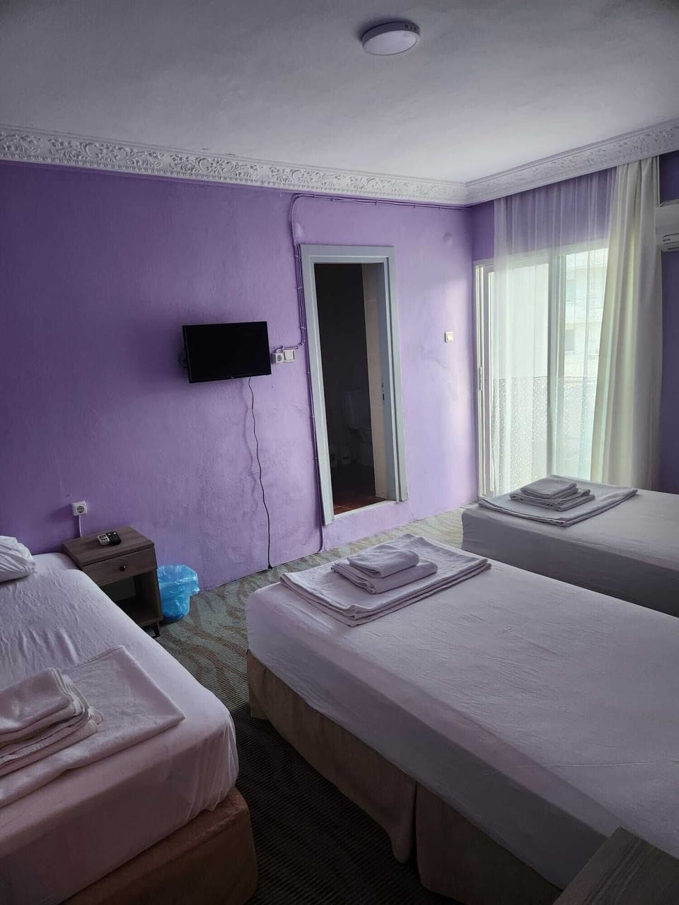 Triple Room, Balcony, City View | WiFi (free), bed sheets