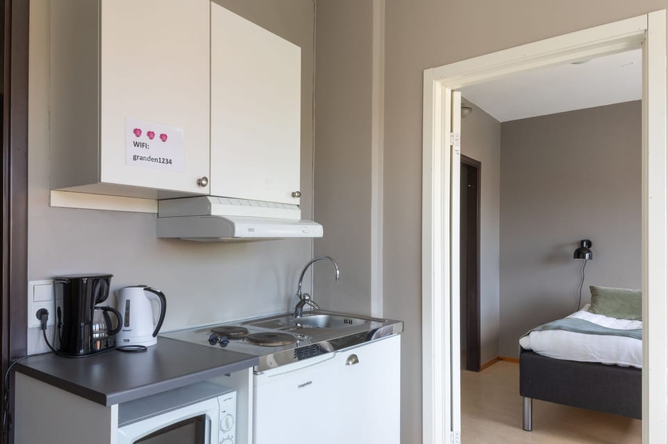 Comfort Apartment, 2 Bedrooms, Private Bathroom, City View | Private kitchen | Highchair, cleaning supplies