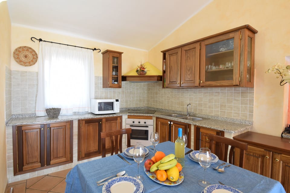 Apartment, Balcony, Sea View | Private kitchen | Fridge, microwave, oven, espresso maker