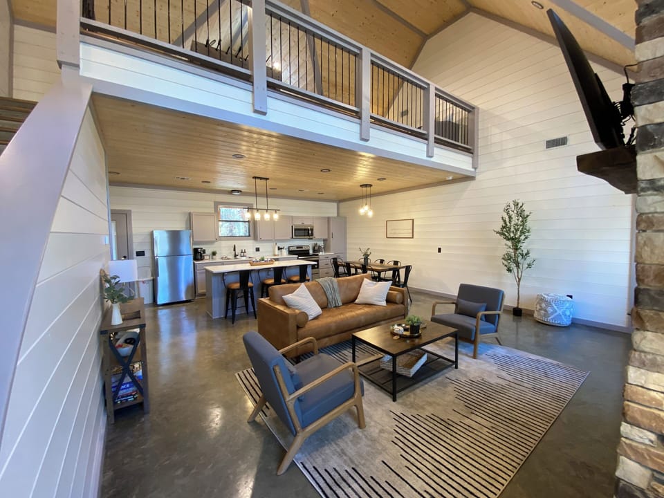 Experience cozy modern luxury with warm wood, open spaces in Broken Bow, OK.