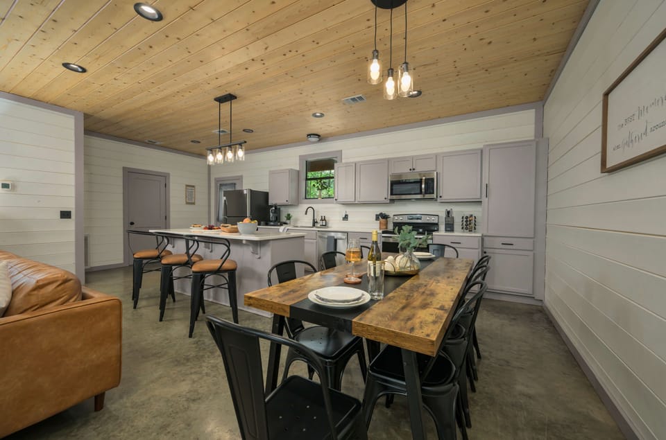 Gather ‘round as this cozy kitchen and rustic dining space