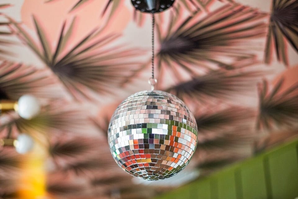 Mirror disco ball in the Disco Lounge — the signature detail of this one-of-a-kind 4-bedroom rental in St. Petersburg, FL.