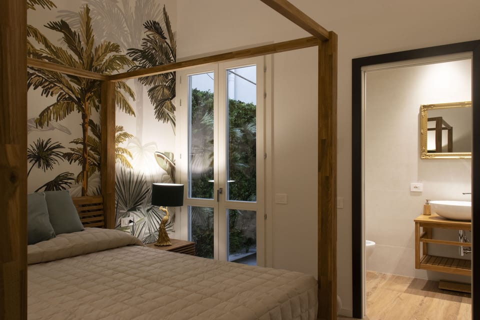 Luxury Double Room, Private Bathroom, Courtyard Area | In-room safe, desk, blackout drapes, soundproofing