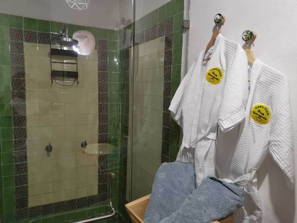 Deluxe Room, 1 Bedroom, Garden View | Bathroom | Shower, rainfall showerhead, bathrobes, towels