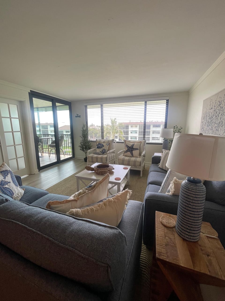 Spacious, light-filled living space with coastal-inspired decor