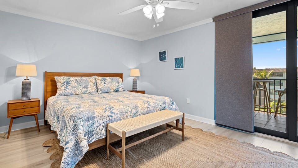 Master bedroom with a king-size bed, brand new comfy mattress, and lanai doors 