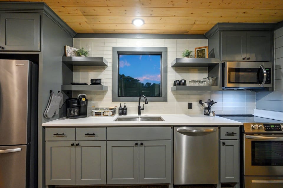A touch of classic charm with grey cupboards.