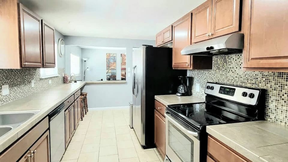 Two kitchens total: Main Floor Kitchen w/ Stainless Steel Appliances