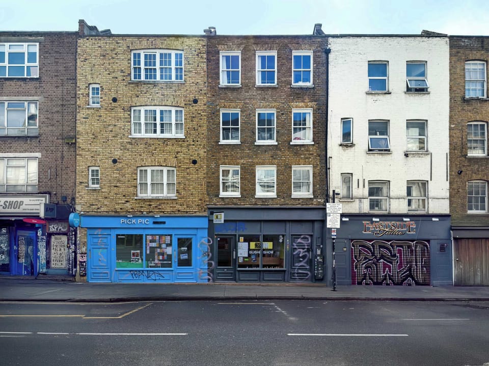 Street view of the neighbourhood, offering a glimpse into the vibrant local area you'll enjoy during your stay