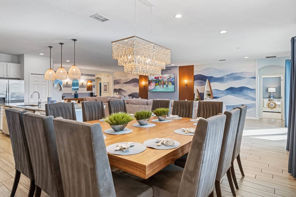 - Elegant dining room with chandelier lighting  
- Large vacation villa for family group gatherings  
- Orlando rental with open floor plan and decor
