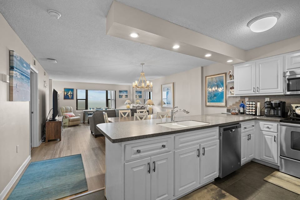 Open concept kitchen, dining & living space