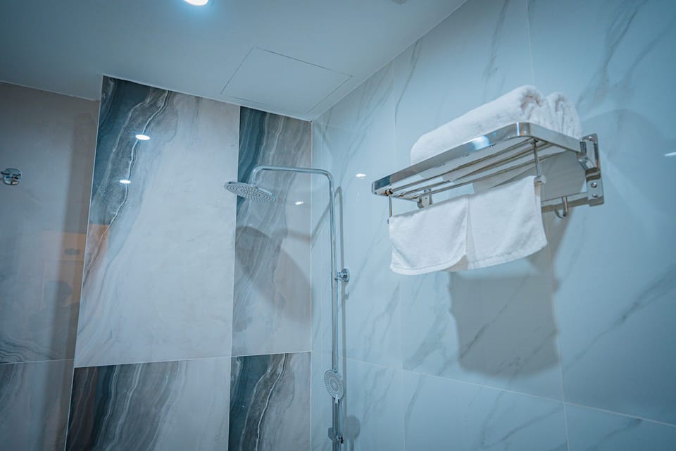 Panoramic Double Room Single Use, Beach View | Bathroom | Shower, hair dryer, bathrobes, towels