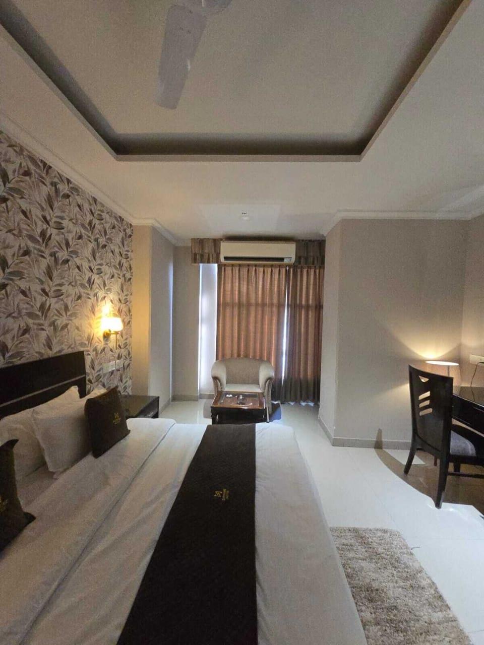 Premium bedding, desk, laptop workspace, soundproofing