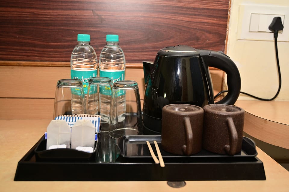 Triple Room, Balcony, Garden View | Coffee and/or coffee maker