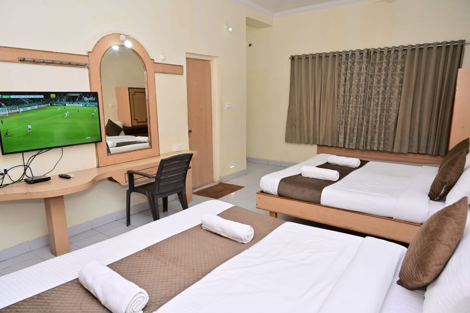 Family Quadruple Room, 2 Queen Beds, Balcony, Garden View | Desk