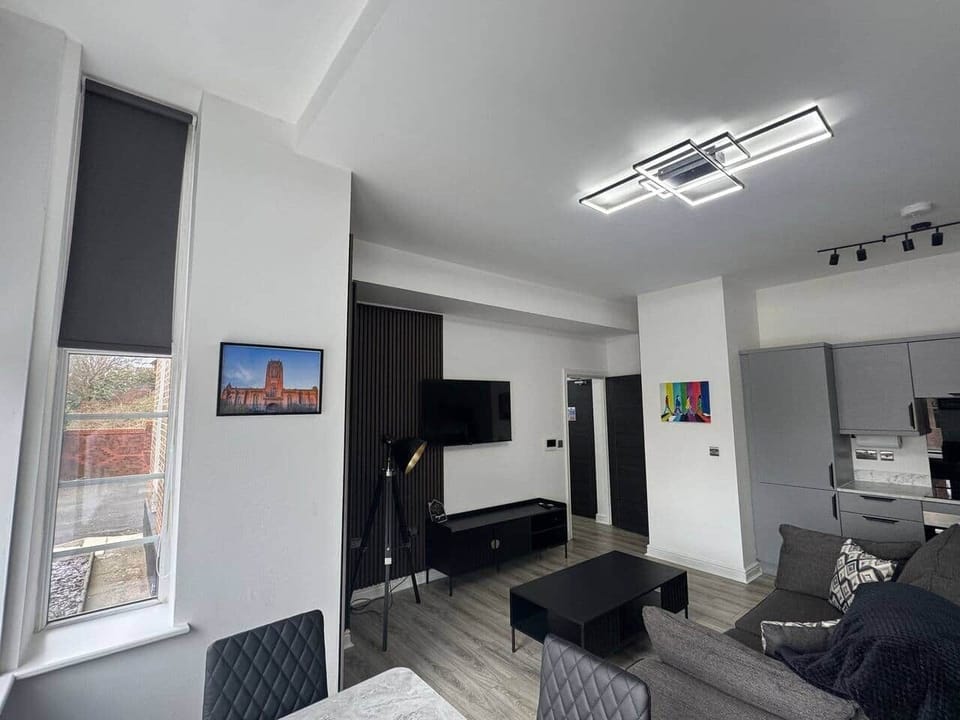 living area with sofa, dining area and smart tv