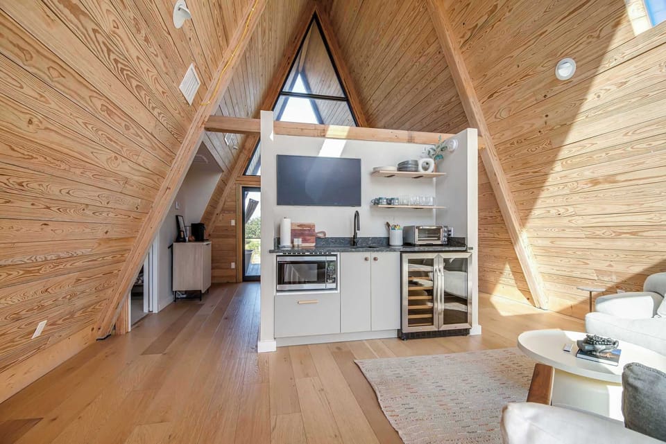 Ceiling to floor windows provide beauitful natural light in the treehouse