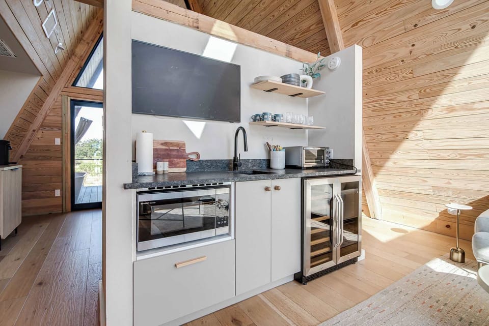 Full kitchenette includes a double door fridge, microwave, toaster and complete set of dishes and utensils.