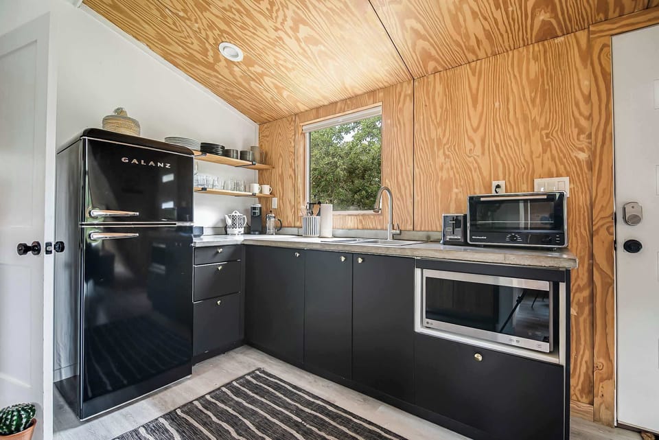 Full kitchen with everything you need to cook at home - including your morning coffee with local coffee grounds.