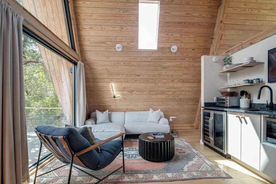 Walk in to the spacious living space complete with a sectional, kitchenette and smart TV.