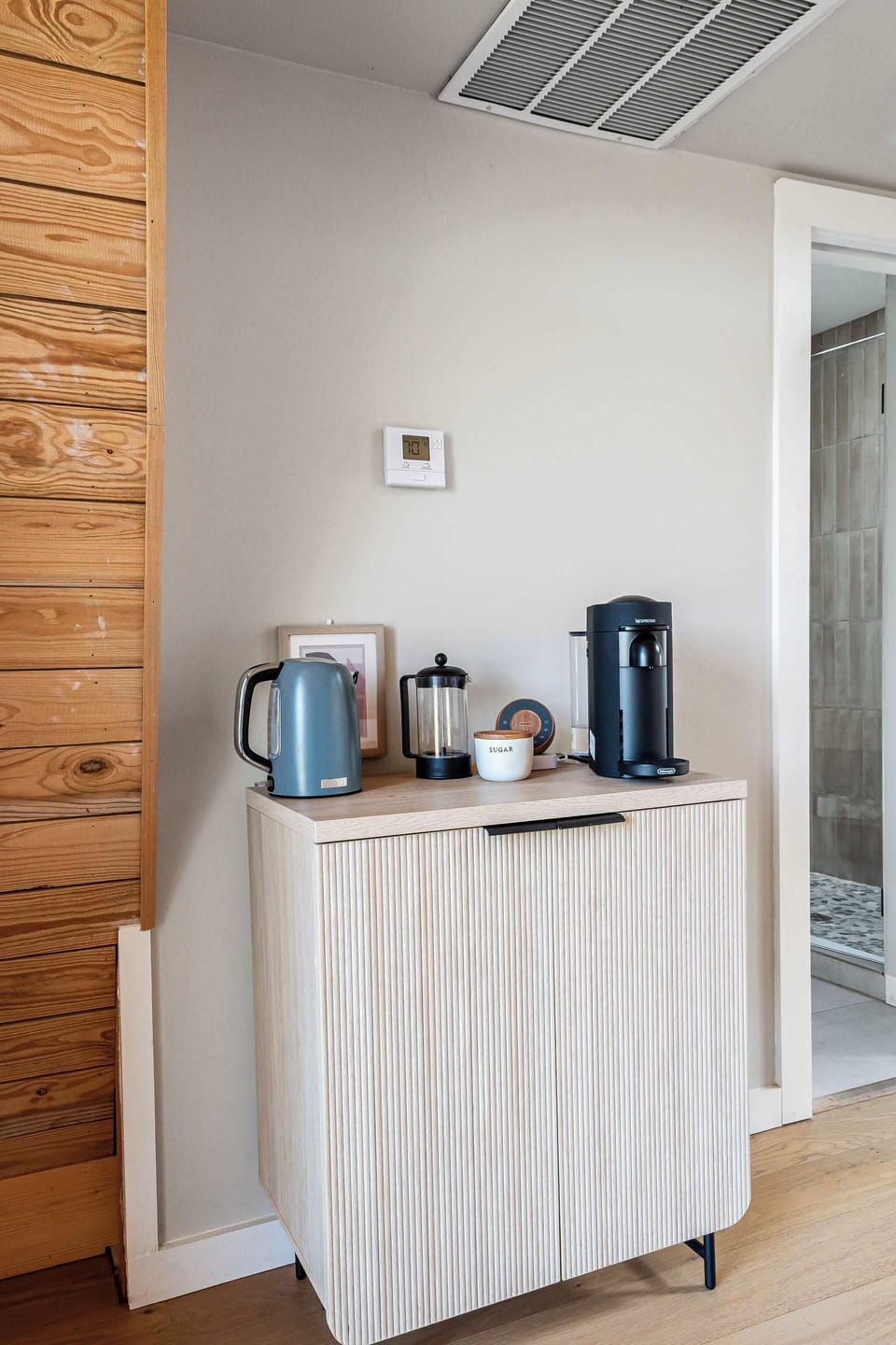Coffee corner located right next to your bed for a slow wake-up with your morning cup of coffee. Electric tea kettle and Nespresso coffee provided.