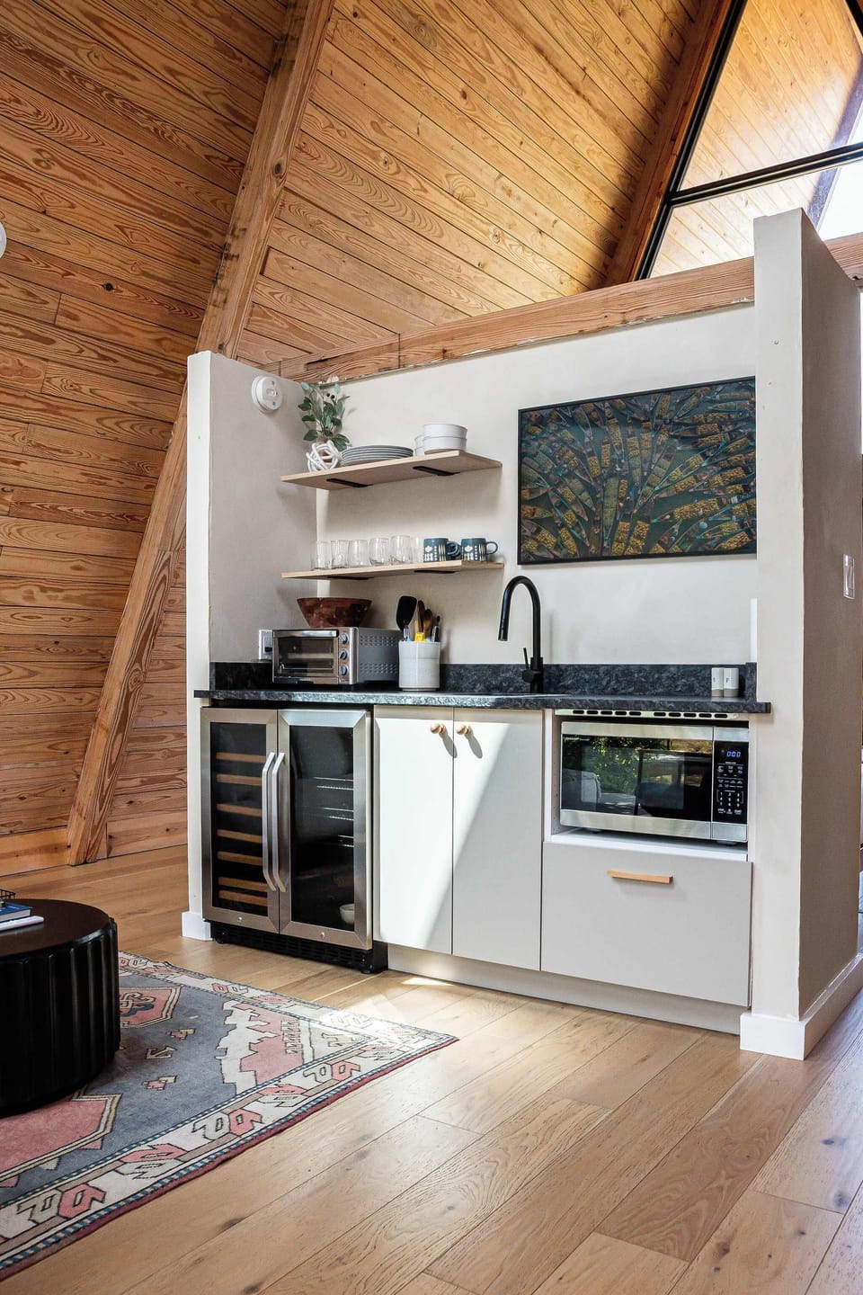 Full kitchenette includes a double door fridge, microwave, toaster and complete set of dishes and utensils