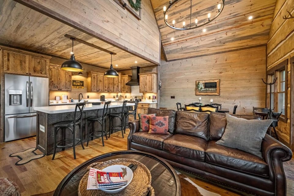 Gather, cook, and relax all in one inviting space where rustic charm, vaulted ceilings, and a warm fire set the tone for your mountain getaway.