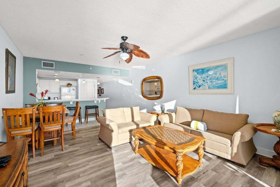This spacious, open-concept floorplan seamlessly blends the living and dining areas, creating the perfect space for relaxing after a day at the beach or sharing a meal with loved ones.