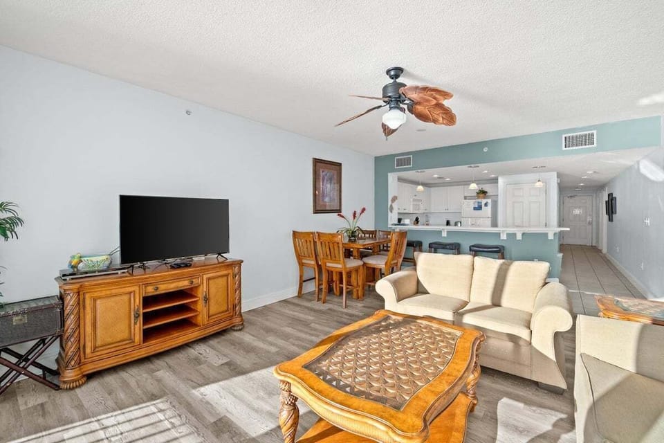 This spacious area features an open-concept layout that seamlessly flows into the dining space, creating the perfect setting for gathering with family and friends.