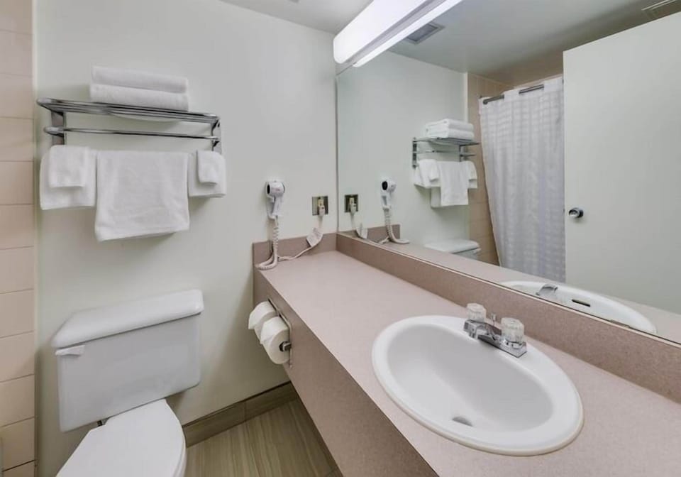 Desk, blackout drapes, WiFi (free), bed sheets