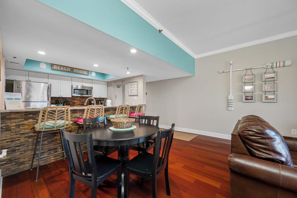 Open-concept living space with bar seating & dining area