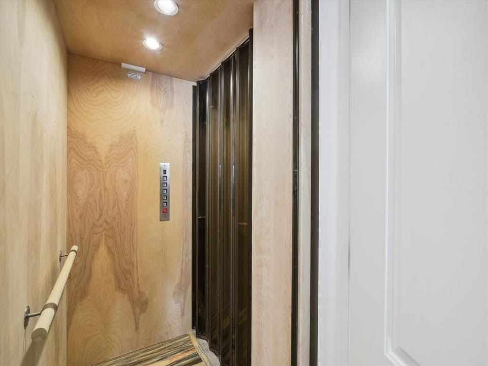 Experience convenience with a private elevator offering easy access to all levels of this stunning waterfront home.