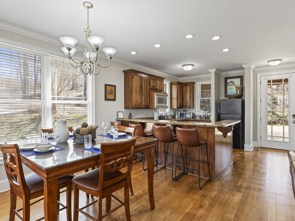 We love having the kitchen and dining space combined. Even better is extending dinner to the screened in patio right beside this space.