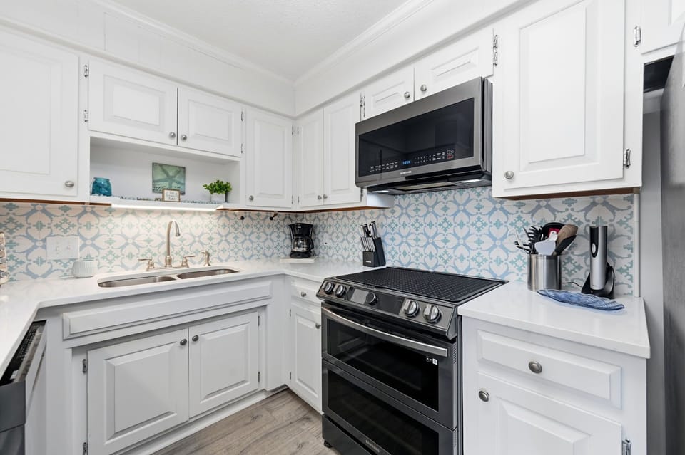 This bright white kitchen blends coastal charm with modern elegance.