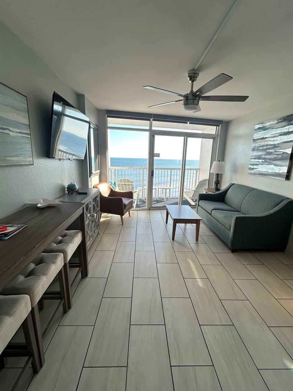 Newly updated and furnished living room with murphy bed and sofa bed for extra sleep spaces.