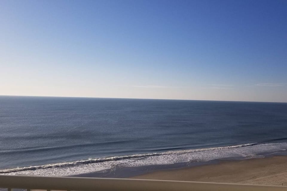 Gaze out at the serene ocean stretching for miles