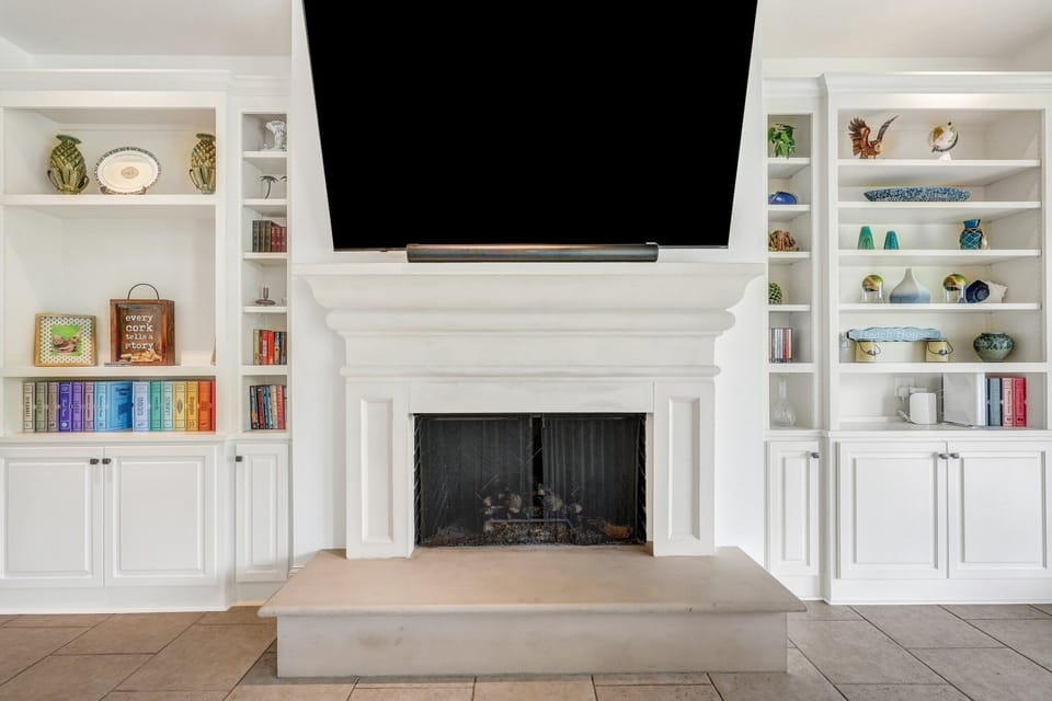 Living room TV equipped with Sonos sound bar and surround sound
