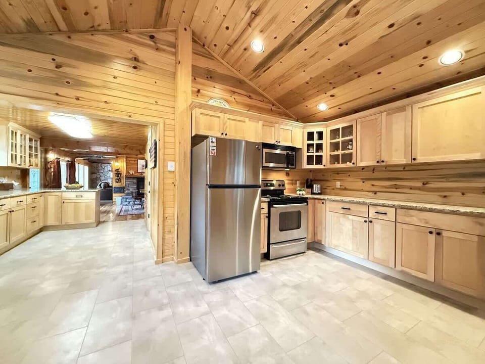 Full kitchen with appliances, cookware, dishes, silverware, and basic cooking spices.