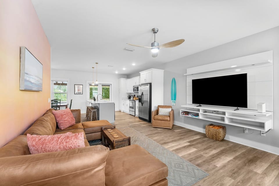 Spacious living room with a sectional and smart TV